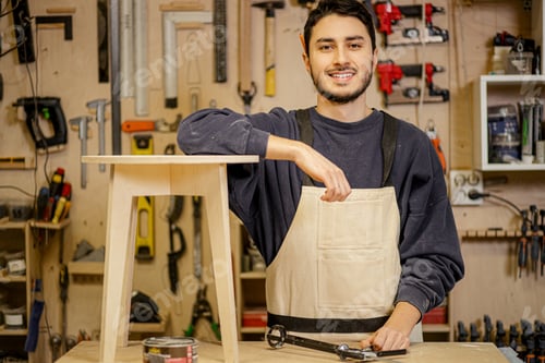 Preview: caucasian furniture maker with handmade wooden chair
