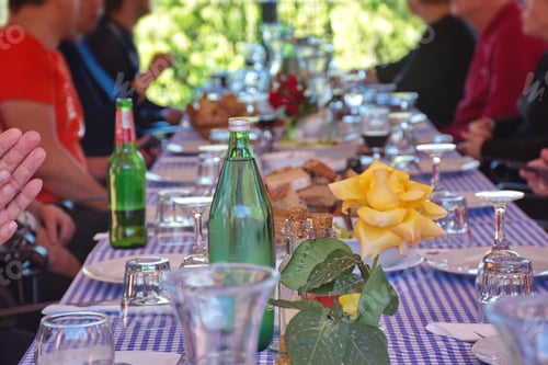 Preview: Midsection of people sitting in restaurant