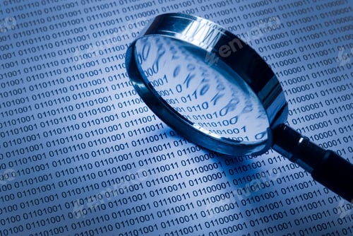 Preview: Selective focus of magnifying glass on a paper sheet of binary code.