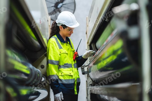 Preview: woman engineer inspection check control heavy machine robot arm construction installation