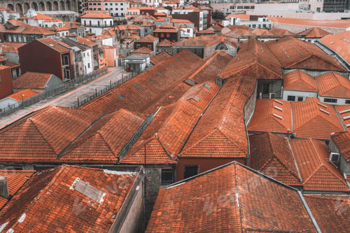 Preview: View from above of red-tiled roofs