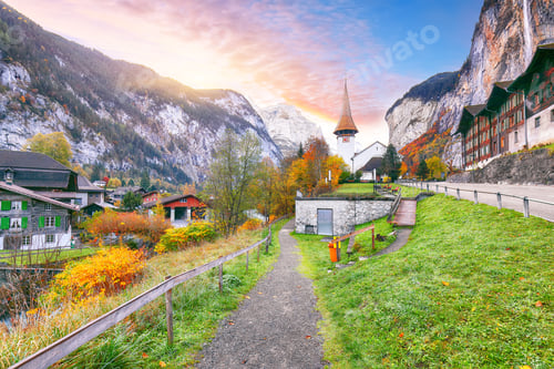 Preview: Stunning autumn view of Lauterbrunnen village with awasome Staubbach waterfall and Swiss Alps