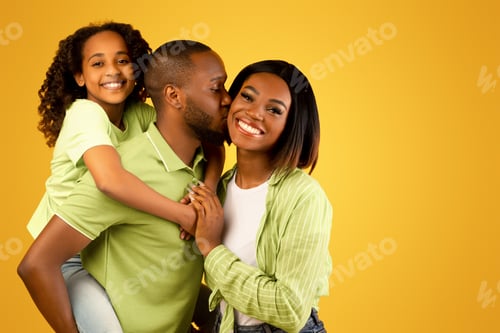 Preview: Playful Family Togetherness, Parent Kissing Cheek of Woman