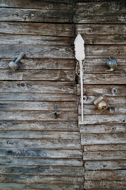 Preview: Rustic Wooden Wall with Antique Utensils and Ladle