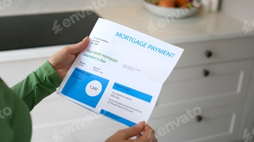 Preview: Close Up Of Woman Opening Mortgage Statement With Higher Rate During Cost Of Living Crisis