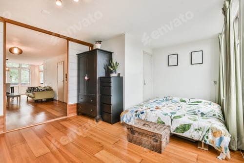 Bedroom with Floral Bedding and Wooden Floors