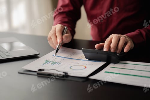 Preview: Business men are looking at the company's financial documents to analyze problems and find solutions