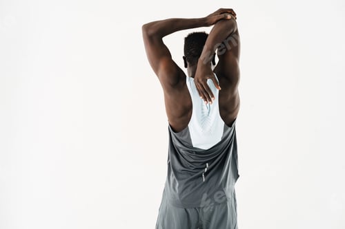 Preview: Young african american sportsman doing exercise while working out