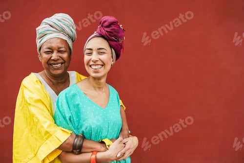 Preview: Happy african mother and daughter wearing traditional clothes