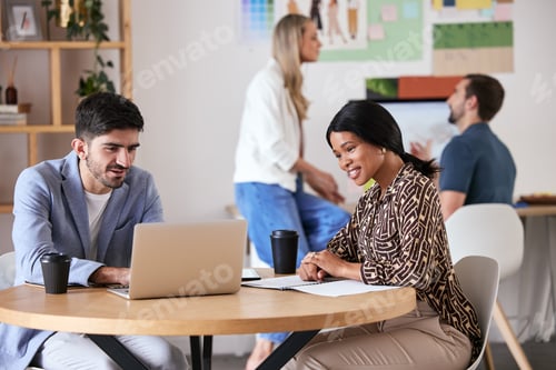 Preview: Collaboration, teamwork and strategy meeting for business colleagues sitting at a desk and working