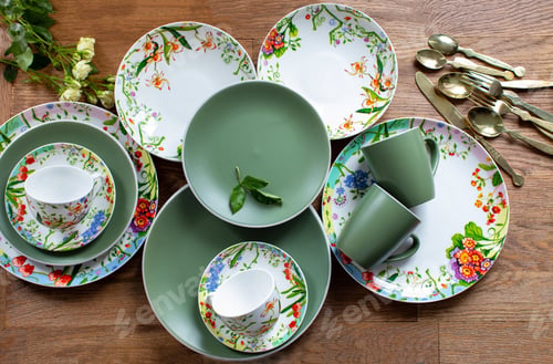 Preview: Top view of a beautiful set of clean tableware on a wooden table