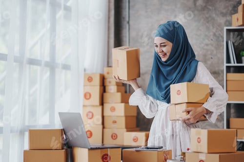 Preview: Small Startup Muslim Woman Checking parcels at work, freelancers, salespeople, checking production o