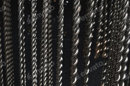 Preview: Drills for drilling concrete in a shop window of a hardware store. Close-up. Selective focus