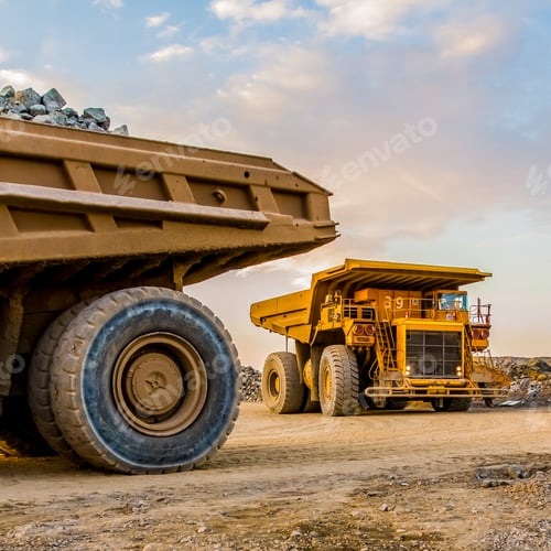 Preview: Machinery and dumping trucks outside a coal mining site