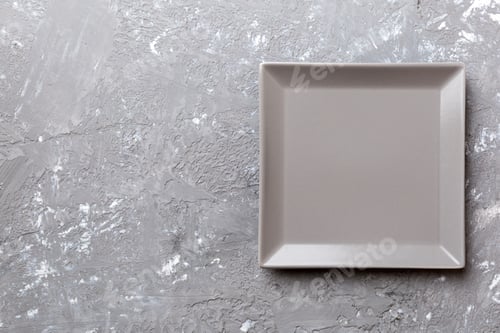 Preview: Top view of empty square plate on cement background. Empty space for your design