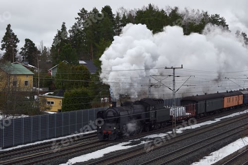 Preview: Old museum locomotive with thick smoke from the chimney.