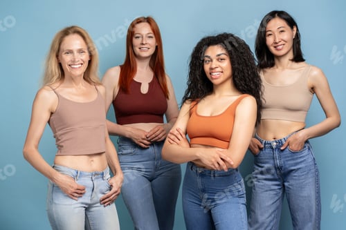 Preview: Diverse group of women smiling and posing confidently in jeans and tank tops