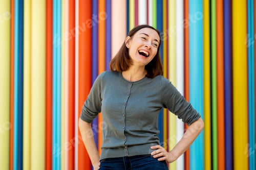 Preview: happy middle age woman against colorful background