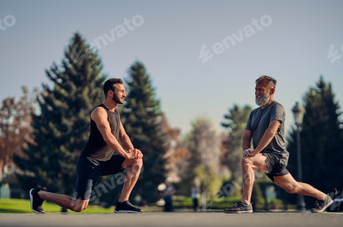 Preview: The young and old athletes stretching outdoor.