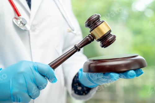 Preview: Doctor holding judge gavel, forensic medicine, medical law and crime justice concept.
