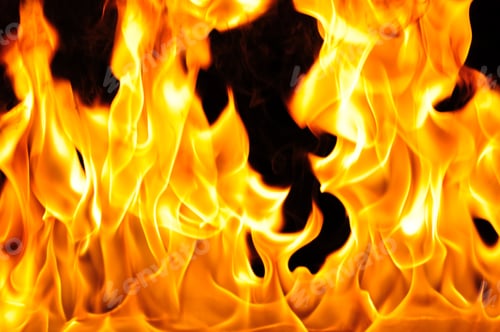 Preview: Bright orange flame on black background