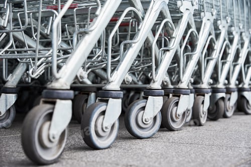 Preview: Many empty shopping carts on the shop parking