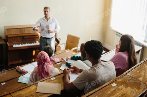 Preview: Teacher Conducting a Classroom Discussion With Engaged Students