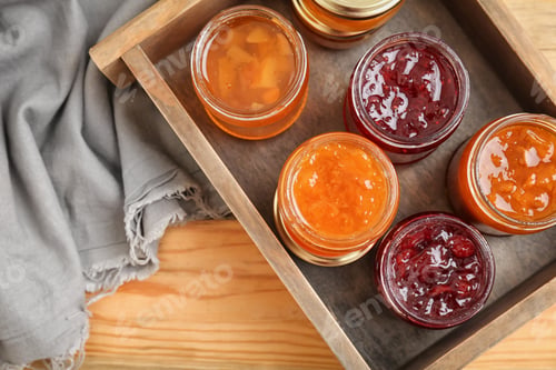 Preview: Jars with different sweet jam in wooden crate
