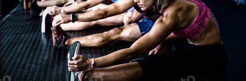 Preview: Side view of athletes stretching