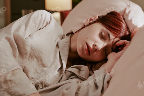 Preview: Peacefully Sleeping Woman in Soft Light Bedding