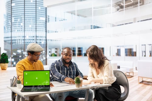 Preview: Realtors team presenting office space layout next to copy space mockup