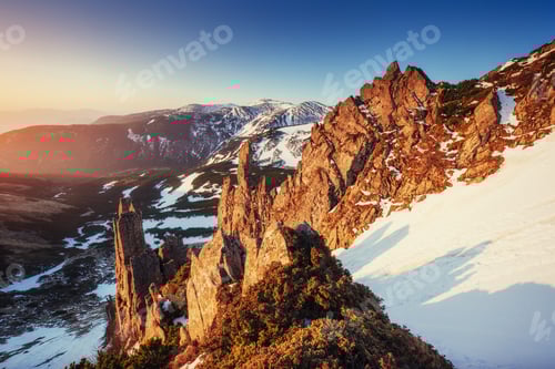 Preview: Colorful spring sunset over the mountain ranges in the national