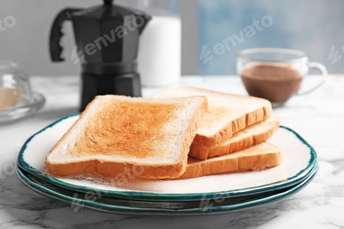 Preview: Plate with toasted bread on table