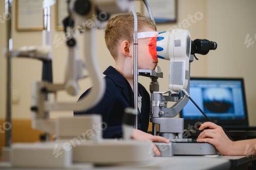 Preview: Child undergoing eyesight examination with ophthalmological equipment in clinic