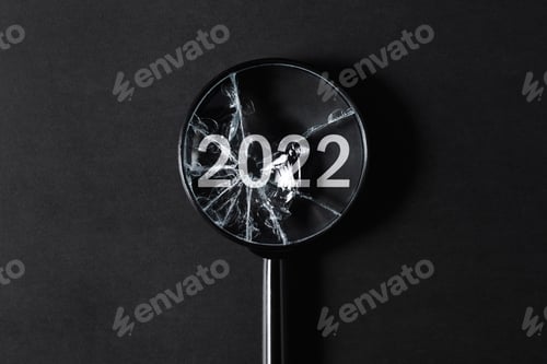 Preview: Bad year, failed plans creative concept. Broken magnifier focused on number 2022