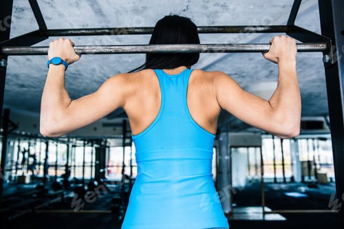 Preview: Back view portrait of a woman working out