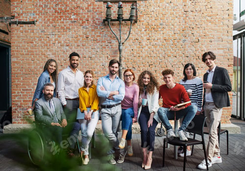 Preview: Group of entrepreneurs looking at camera indoors in office, inclusion of disabled ceoncept