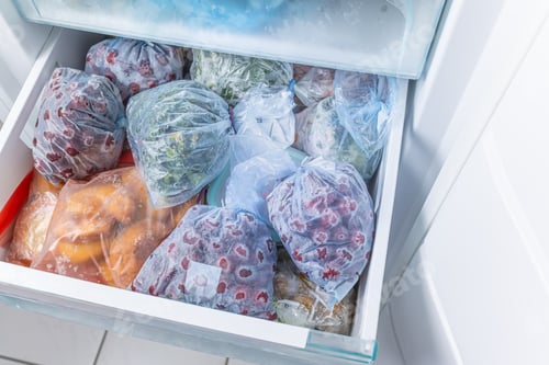 Preview: Frozen fruits and vegetables in a plastic bags in freezer with no-frost, household concept