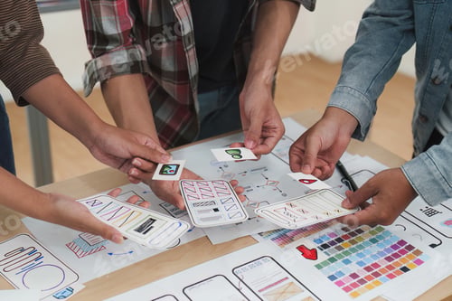 Preview: Close up ux developer and ui designer brainstorming interface wireframe design.Creative digital