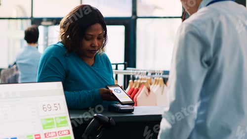 Preview: Client paying for casual wear with phone