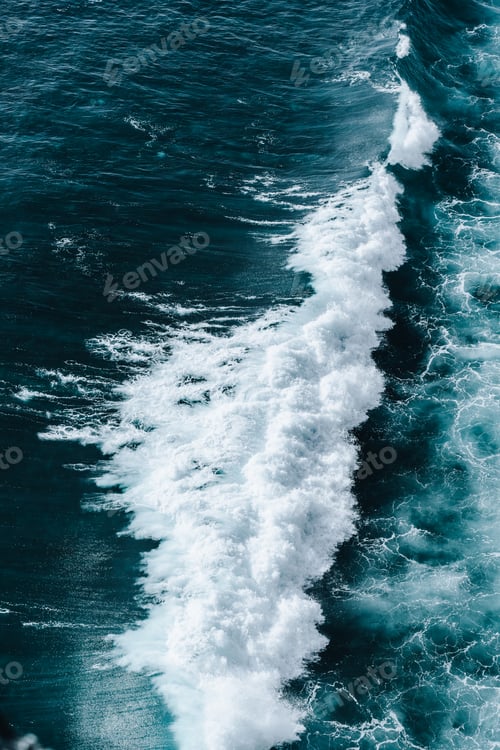 Preview: Top down of waves crashing in ocean near Uluwatu temple in Bali, Indonesia