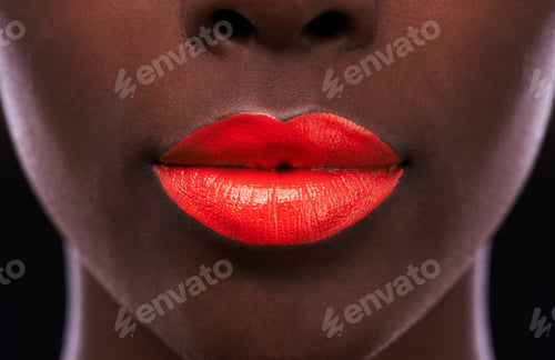 Preview: The perfect pout. Cropped view of an african woman with bright red lips.