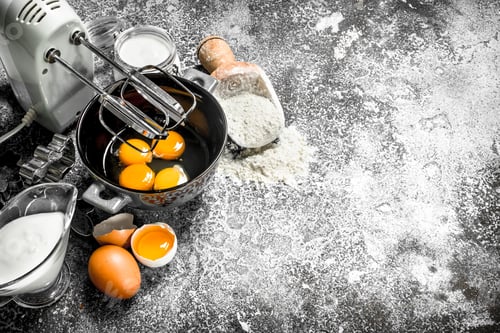 Preview: Baking background. Blend eggs with a mixer to make a dough.