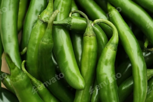 Preview: Green hot chili peppers as background, closeup