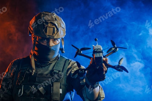 Preview: A soldier is depicted holding a drone while wearing stealth gear for military operations