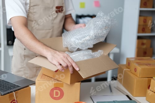 Preview: Starting small businesses SME owners male entrepreneurs working on receipt box and check online