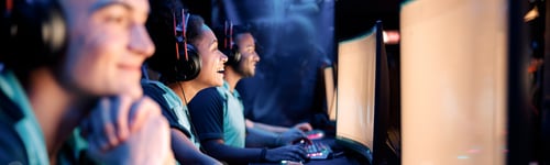 Preview: Professional team playing esports game on computers in internet club