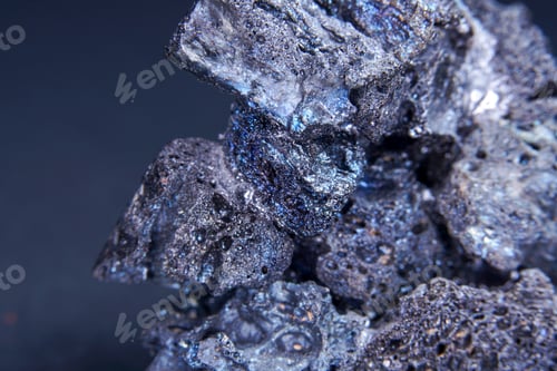 Vista previa: Macro shot of a Magnetite mineral specimen on a blurred background