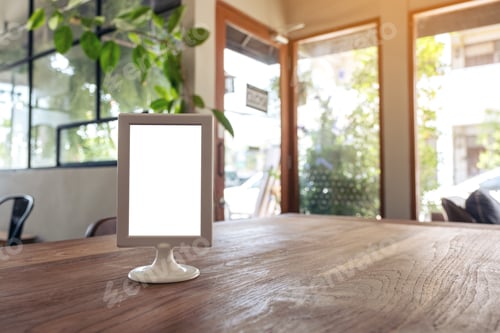 Preview: A blank menu sign on wooden table in cafe