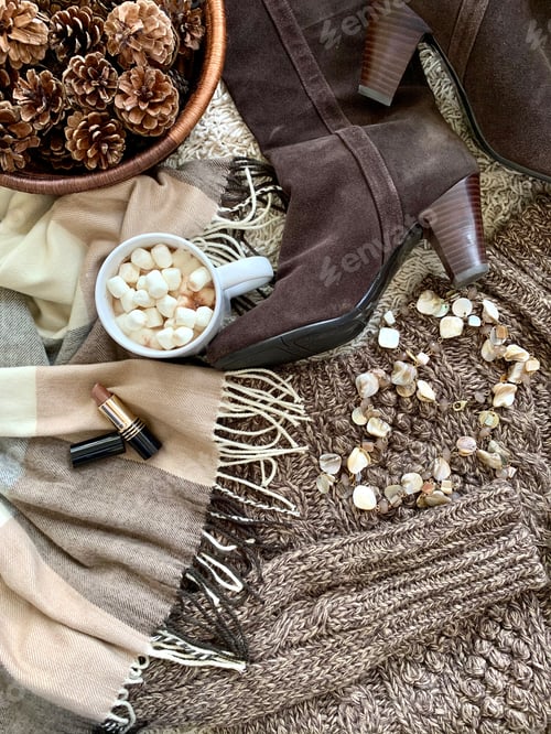 Preview: Fall winter fashion flat lay boots wool cable sweater scarf pine cones hot chocolate & marshmallow